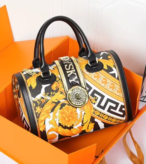 Luksuzna ženska torba Élora Baroque u zlatno-crnoj boji sa baroknim dezenom i metalnim detaljima